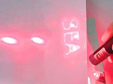 Hologram sticker with laser covert image showing SEA