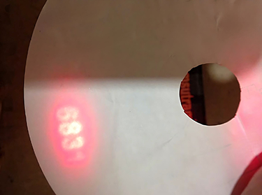 Hologram with laser covert image showing numbering