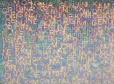 hologram sticker with nano-text under microscope