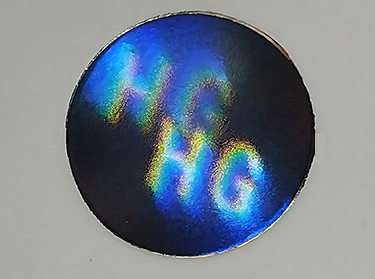 Hologram sticker with optical lens