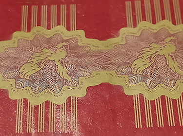 Intaglio printing with guilloche design on the paper label