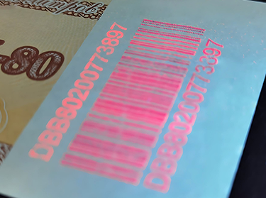 Security voucher with invisible ink printed on barcode